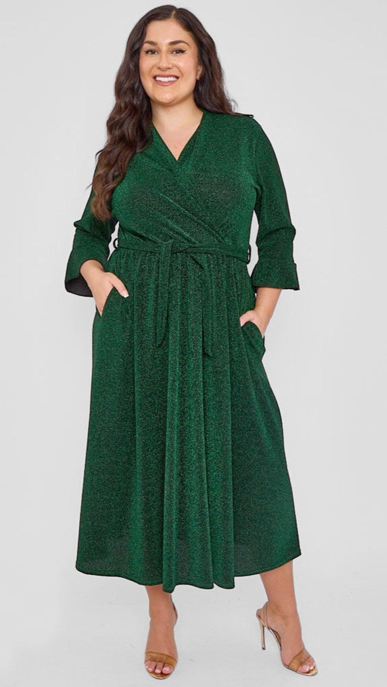 Woman wearing a green dress against a white background