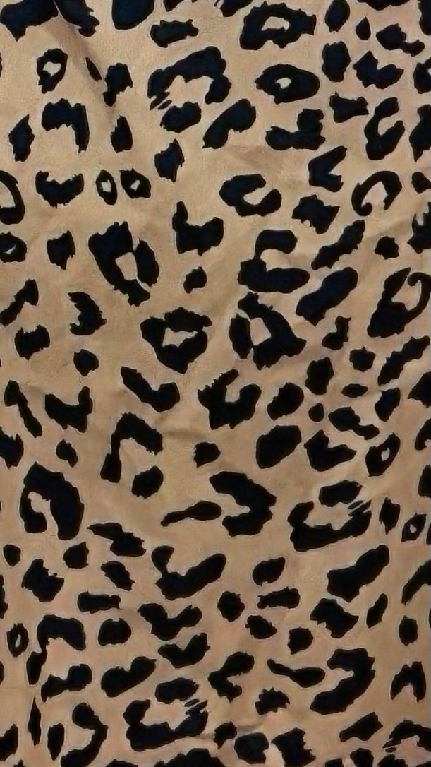 Leopard print pattern on a beige background
